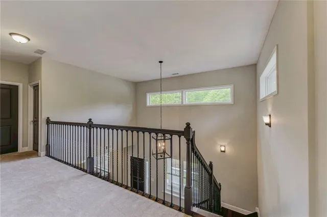 a view of hallway with windows