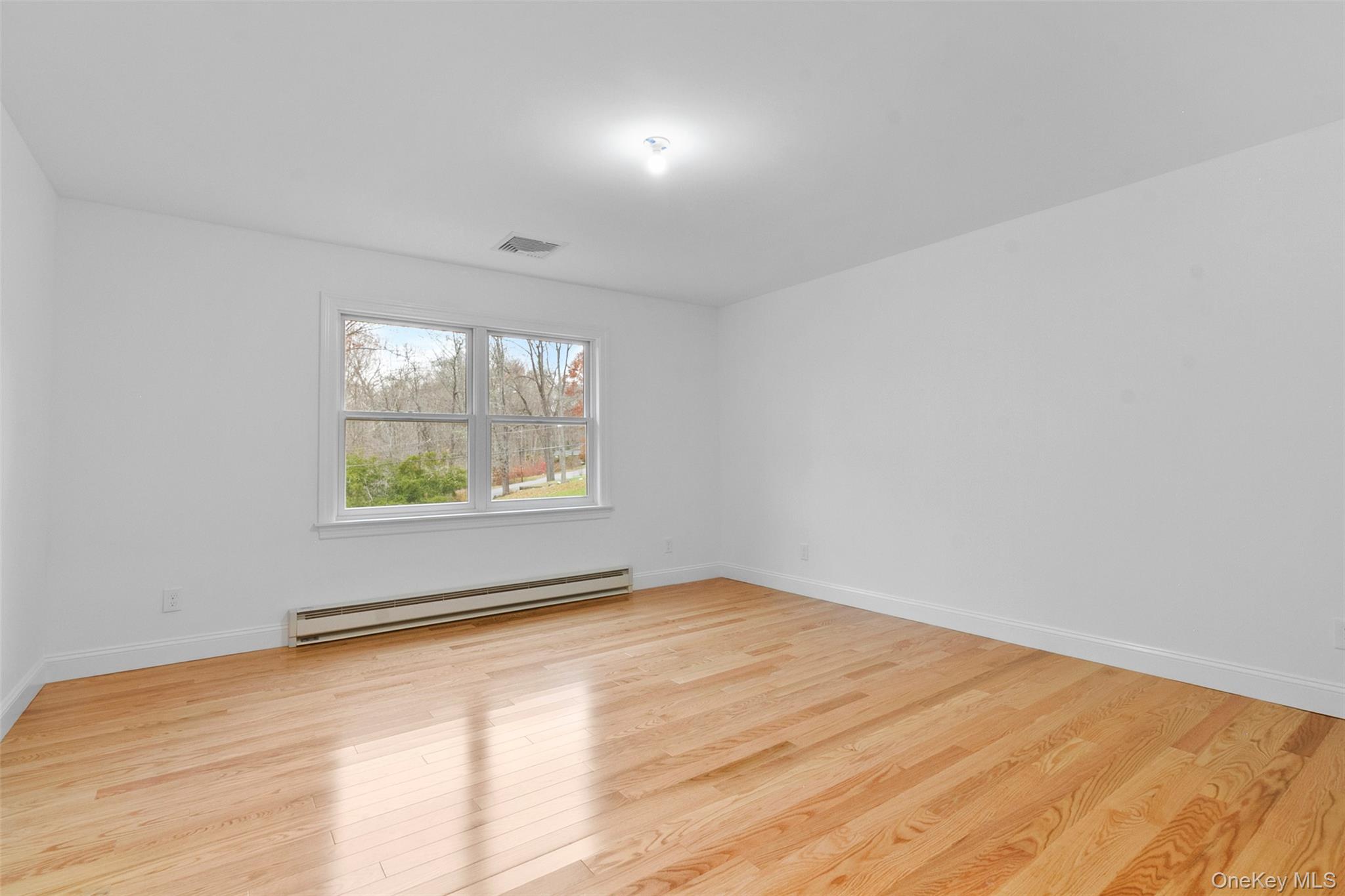 7 Tulip Road Lincolndale, NY 10541 - Photo 12 of 24 wooden floor in an empty room with a window