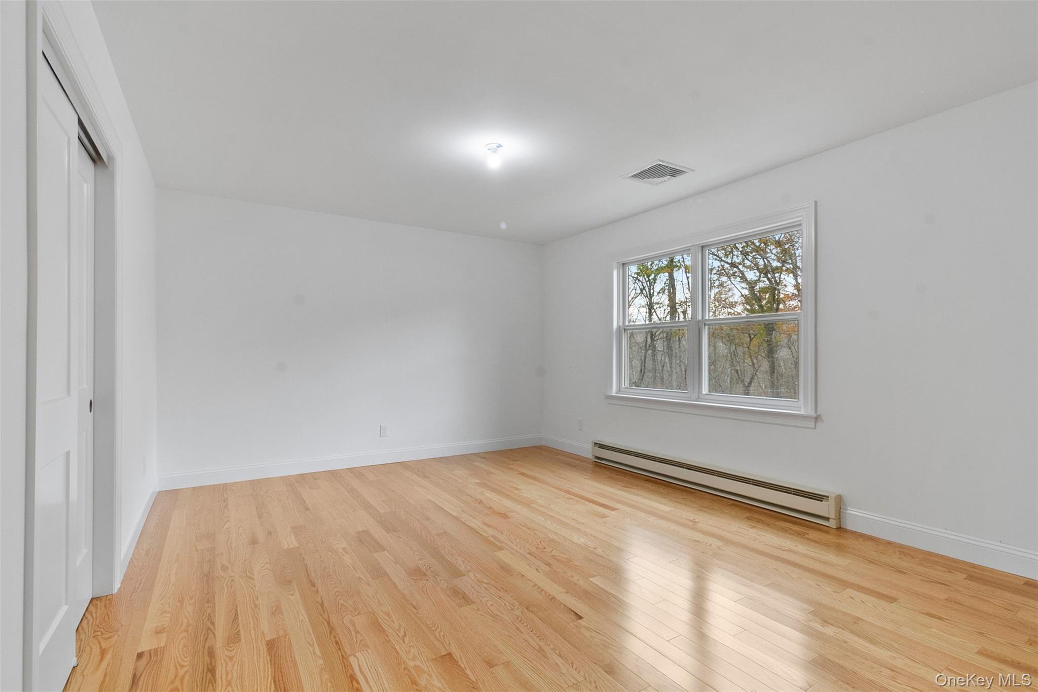 7 Tulip Road Lincolndale, NY 10541 - Photo 16 of 24 a view of an empty room with wooden floor and a window