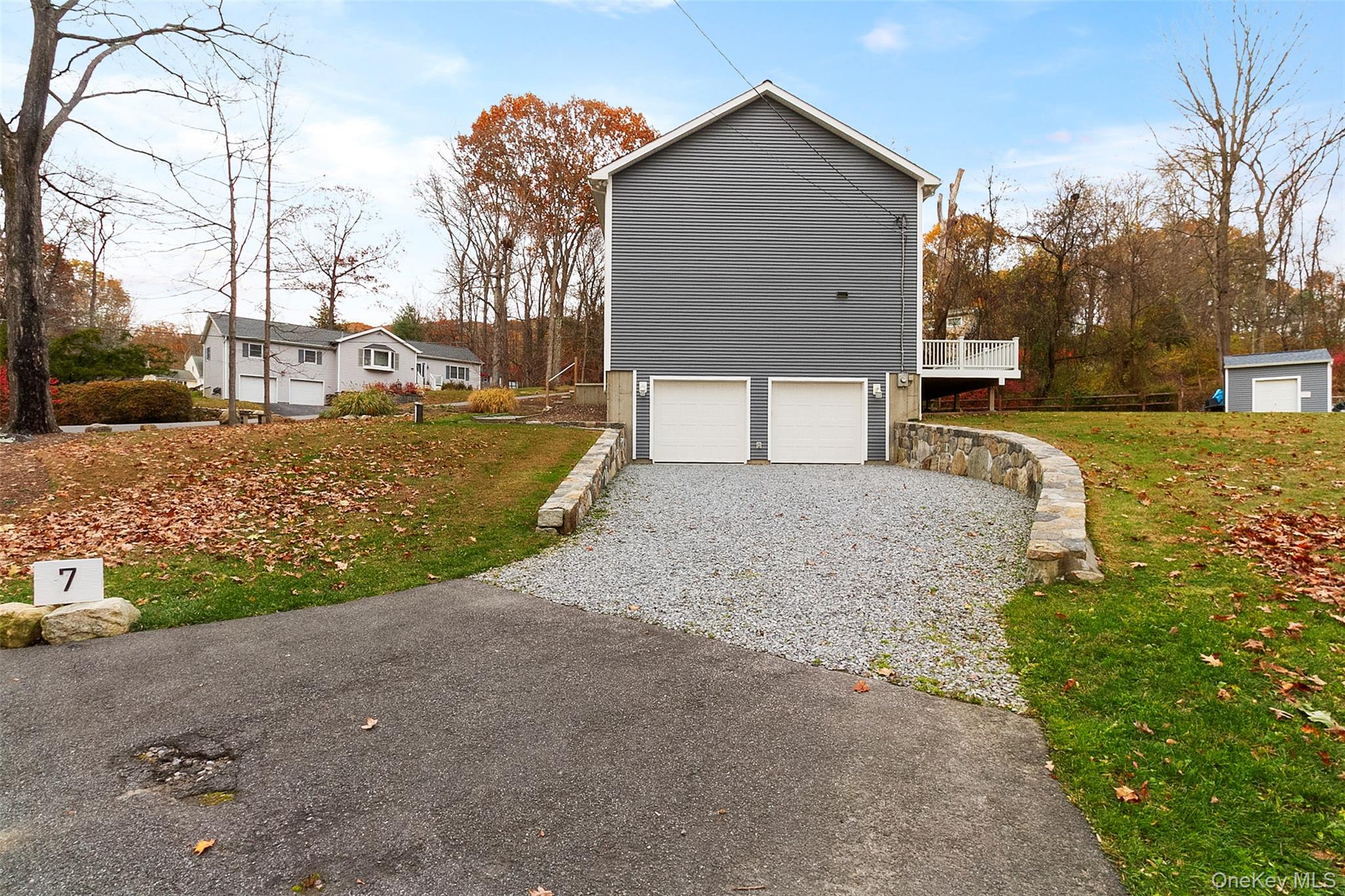 7 Tulip Road Lincolndale, NY 10541 - Photo 23 of 24 a front view of a house with a yard and garage