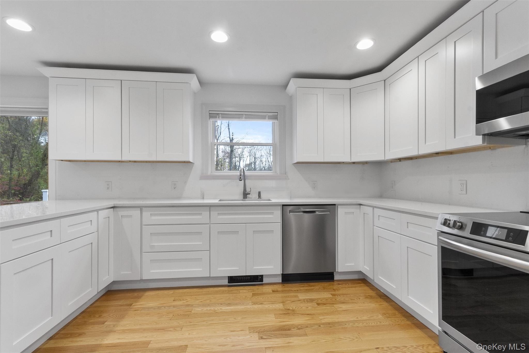 7 Tulip Road Lincolndale, NY 10541 - Photo 4 of 24 a kitchen with stainless steel appliances granite countertop a stove a sink and a microwave