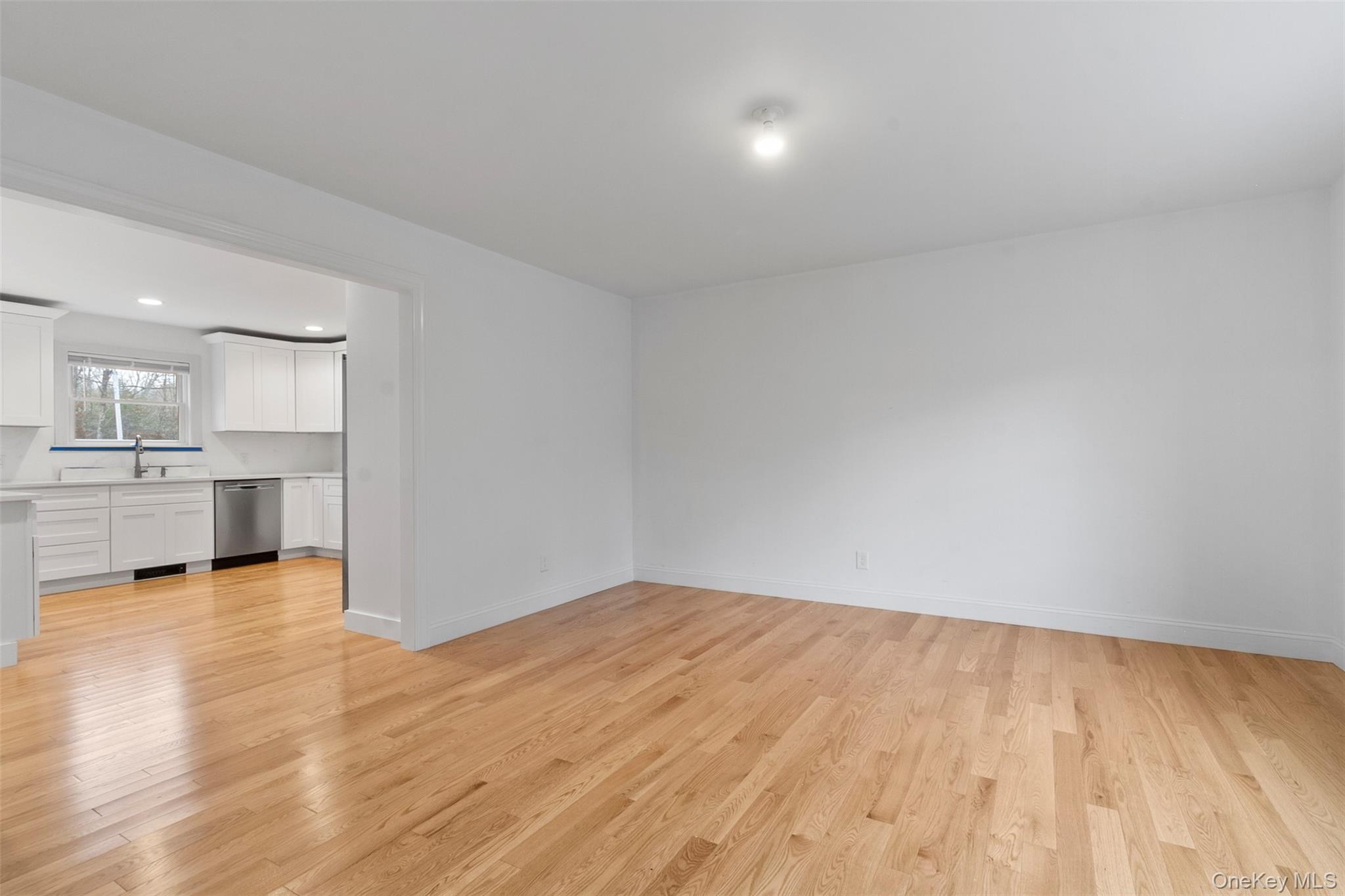 7 Tulip Road Lincolndale, NY 10541 - Photo 8 of 24 a view of a kitchen with wooden floor and a sink