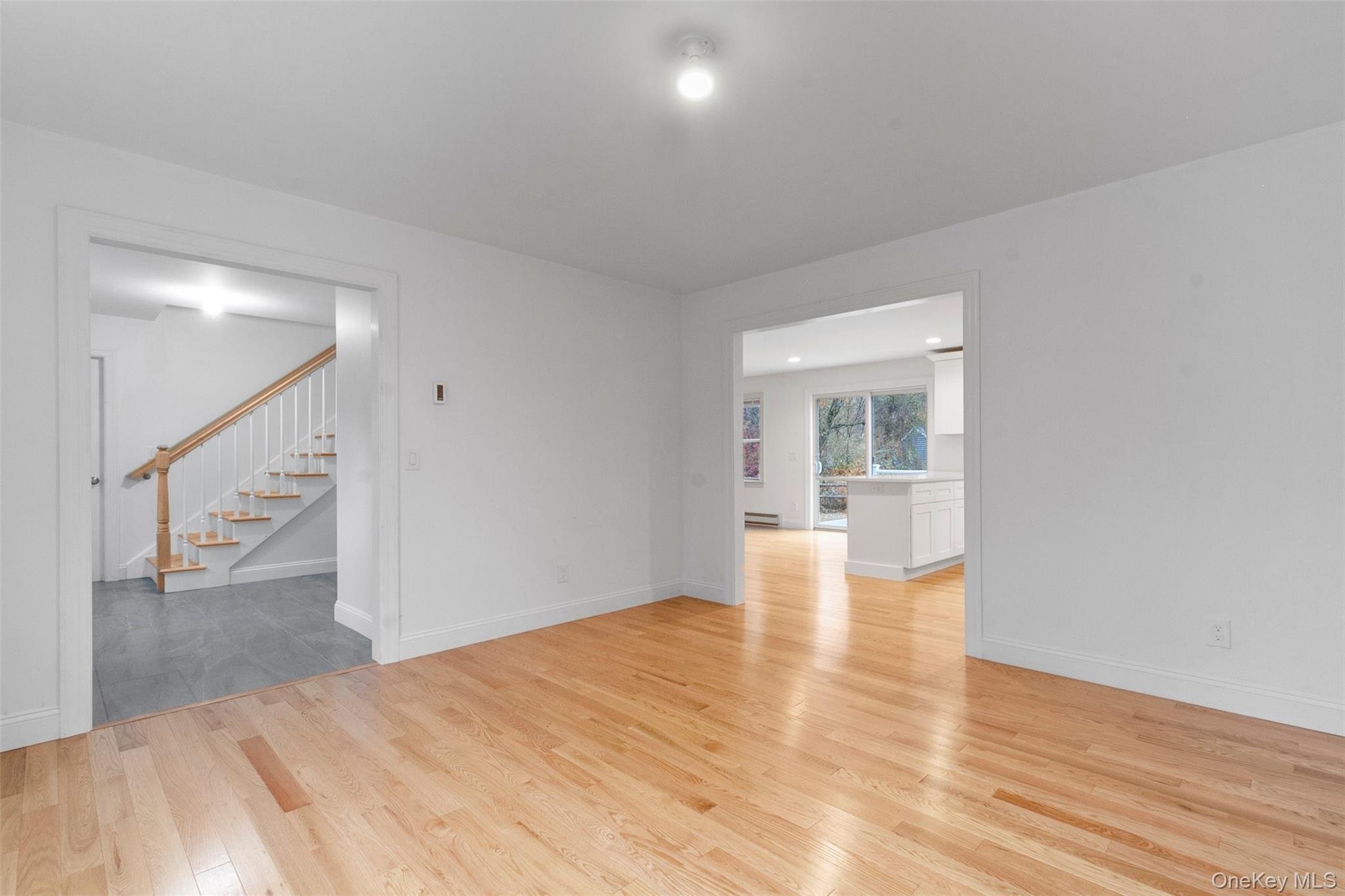 7 Tulip Road Lincolndale, NY 10541 - Photo 10 of 24 a view of empty room with wooden floor and fireplace