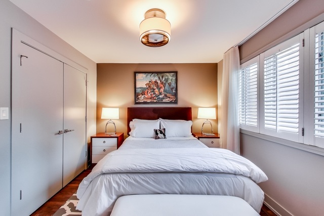 55 West Goethe Street, Unit 1233 Chicago, IL 60610 - Photo 19 of 31 a bedroom with a large bed and a window