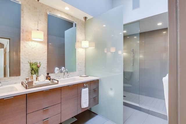 55 West Goethe Street, Unit 1233 Chicago, IL 60610 - Photo 27 of 31 a bathroom with a double vanity sink mirror and shower