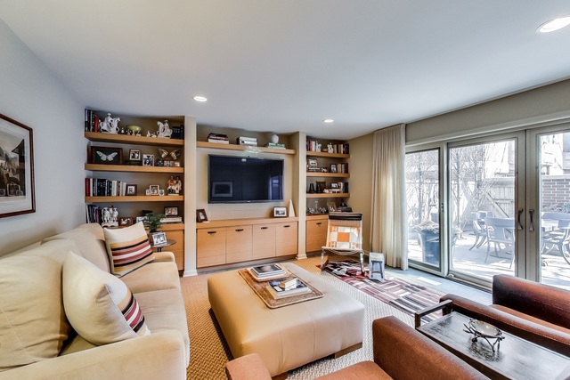 55 West Goethe Street, Unit 1233 Chicago, IL 60610 - Photo 5 of 31 a living room with furniture and a flat screen tv