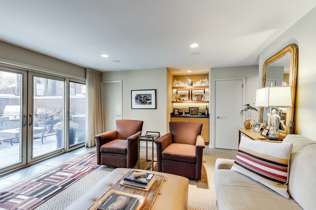 55 West Goethe Street, Unit 1233 Chicago, IL 60610 - Photo 6 of 31 a living room with furniture floor to ceiling window and wooden floor