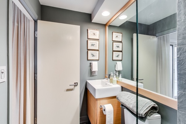 55 West Goethe Street, Unit 1233 Chicago, IL 60610 - Photo 7 of 31 a bathroom with a sink and a mirror