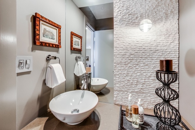 55 West Goethe Street, Unit 1233 Chicago, IL 60610 - Photo 9 of 31 a bathroom with a toilet sink and mirror