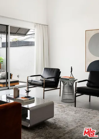 a view of entryway with wooden table and chairs