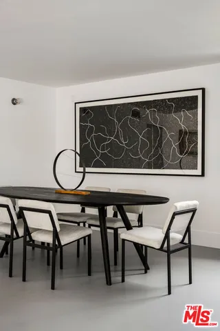 a view of a backyard with table and chairs