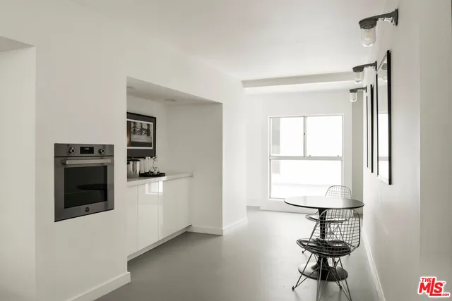 a view of a livingroom with furniture and window