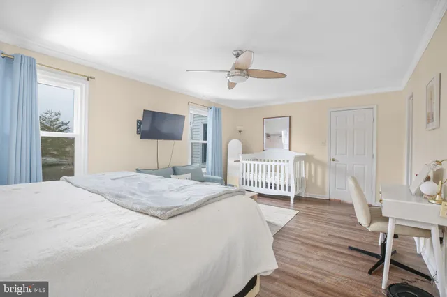 a bedroom with a bed and a table