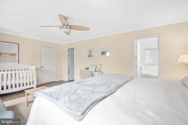 a bedroom with a bed and cabinets