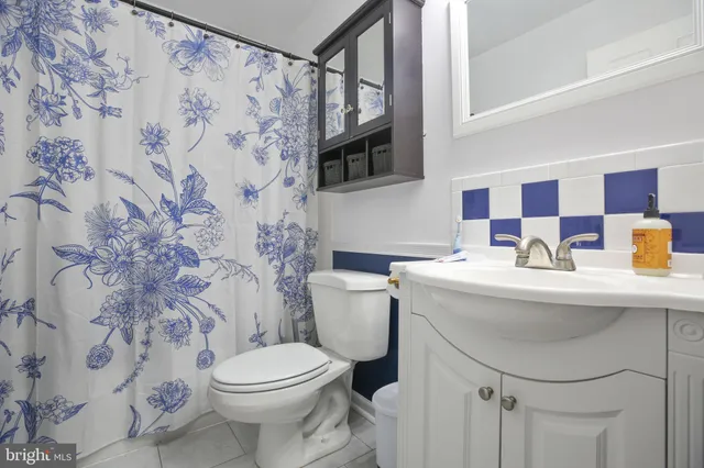 a bedroom with bed and a window