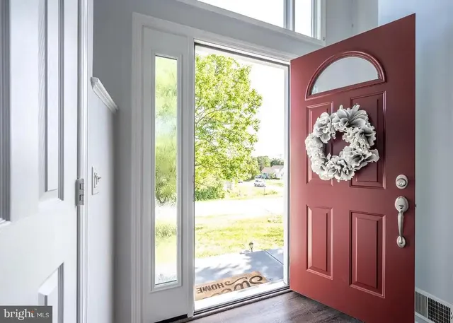 a view of a door and chair in a room