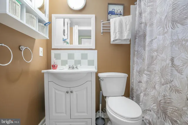 a bedroom with bed and a couch