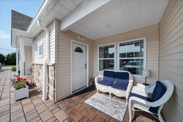 a living room with furniture and a rug