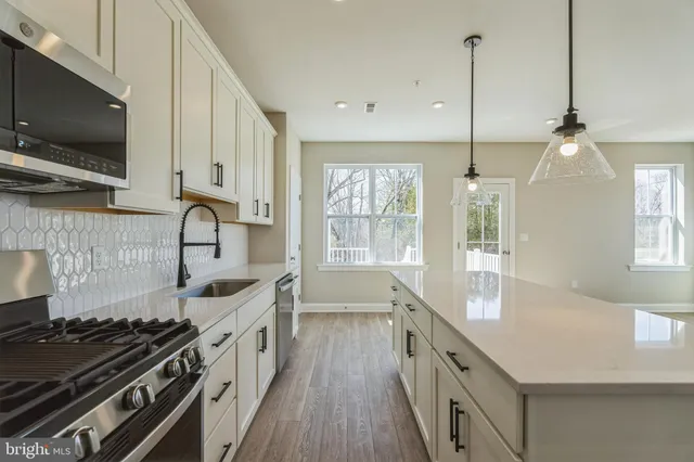 a kitchen with a stove and a sink