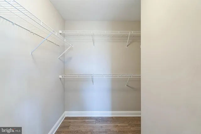 a view of an empty walk in closet