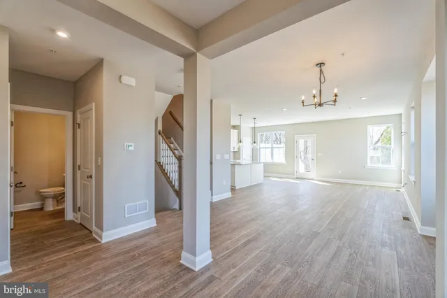 a view of livingroom with hardwood floor and a ceiling fan