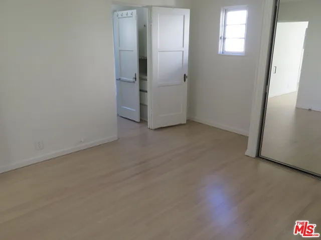 a bathroom with a sink toilet and mirror