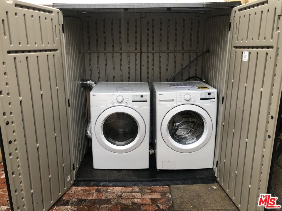 2128 20th Street, Unit B Santa Monica, CA 90405 - Photo 17 of 22 a view of a storage & utility room with dryer and washer