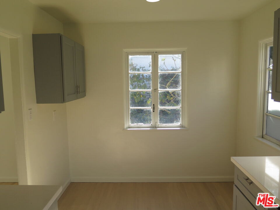 2128 20th Street, Unit B Santa Monica, CA 90405 - Photo 9 of 22 a view of an empty room with a window