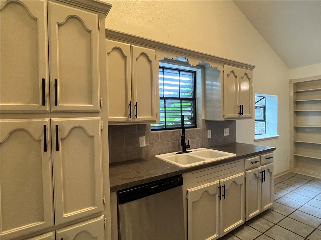2930 River Crest Road Corpus Christi, TX 78415 - Photo 11 of 27 a kitchen with a sink and a refrigerator