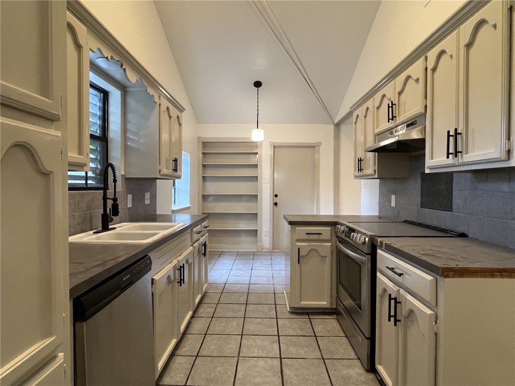 2930 River Crest Road Corpus Christi, TX 78415 - Photo 10 of 27 a kitchen with stainless steel appliances granite countertop a stove and a sink