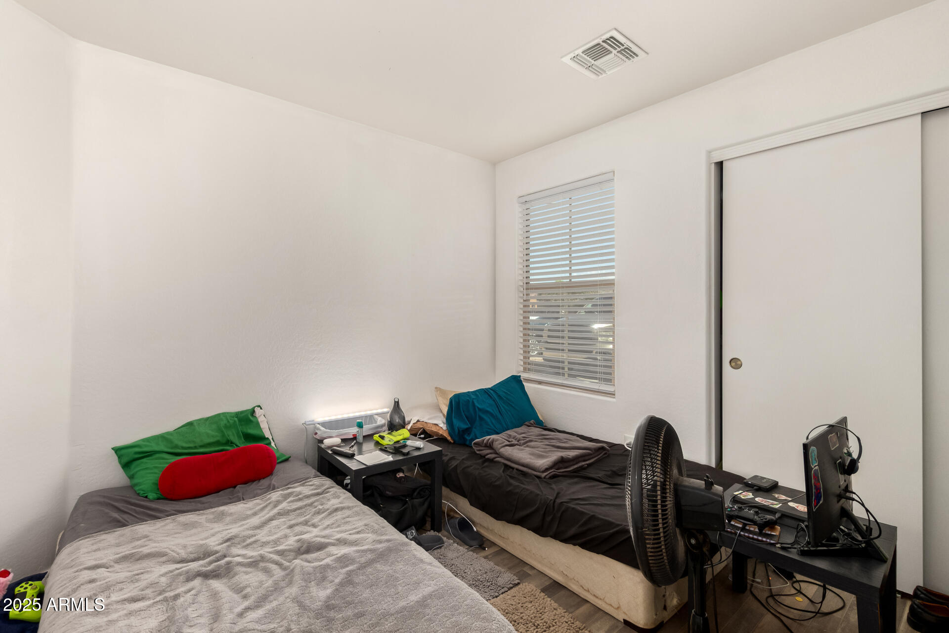 910 Prior Avenue Coolidge, AZ 85128 - Photo 13 of 22 a bedroom with furniture and a window