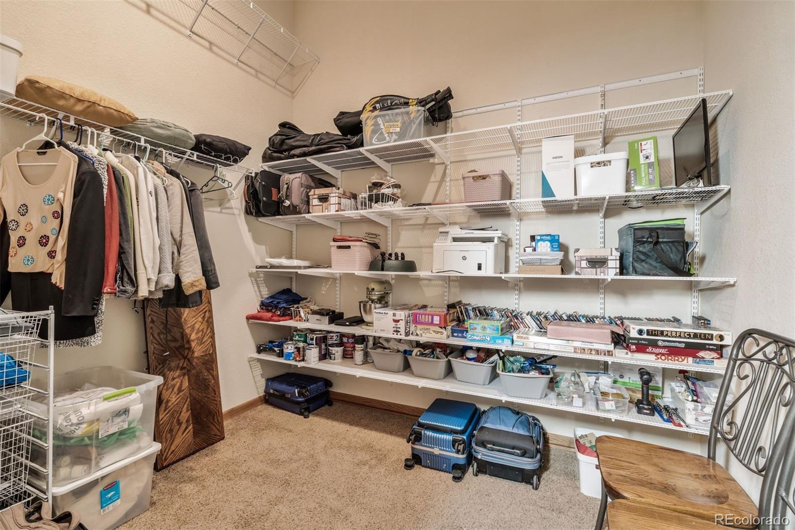89310 Ryan Gulch Road, Unit 403 Silverthorne, CO 80498 - Photo 27 of 40 a view of walk in closet with clothes and shoes
