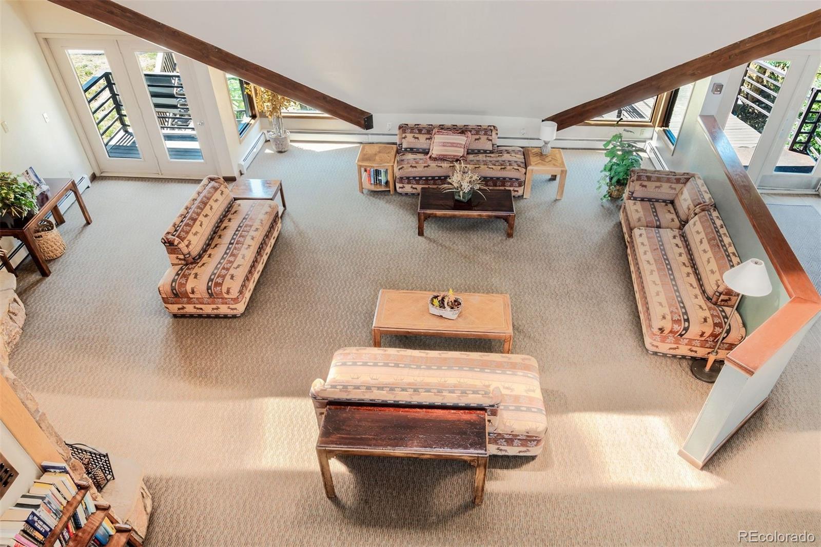 89310 Ryan Gulch Road, Unit 403 Silverthorne, CO 80498 - Photo 31 of 40 a room with furniture and rug