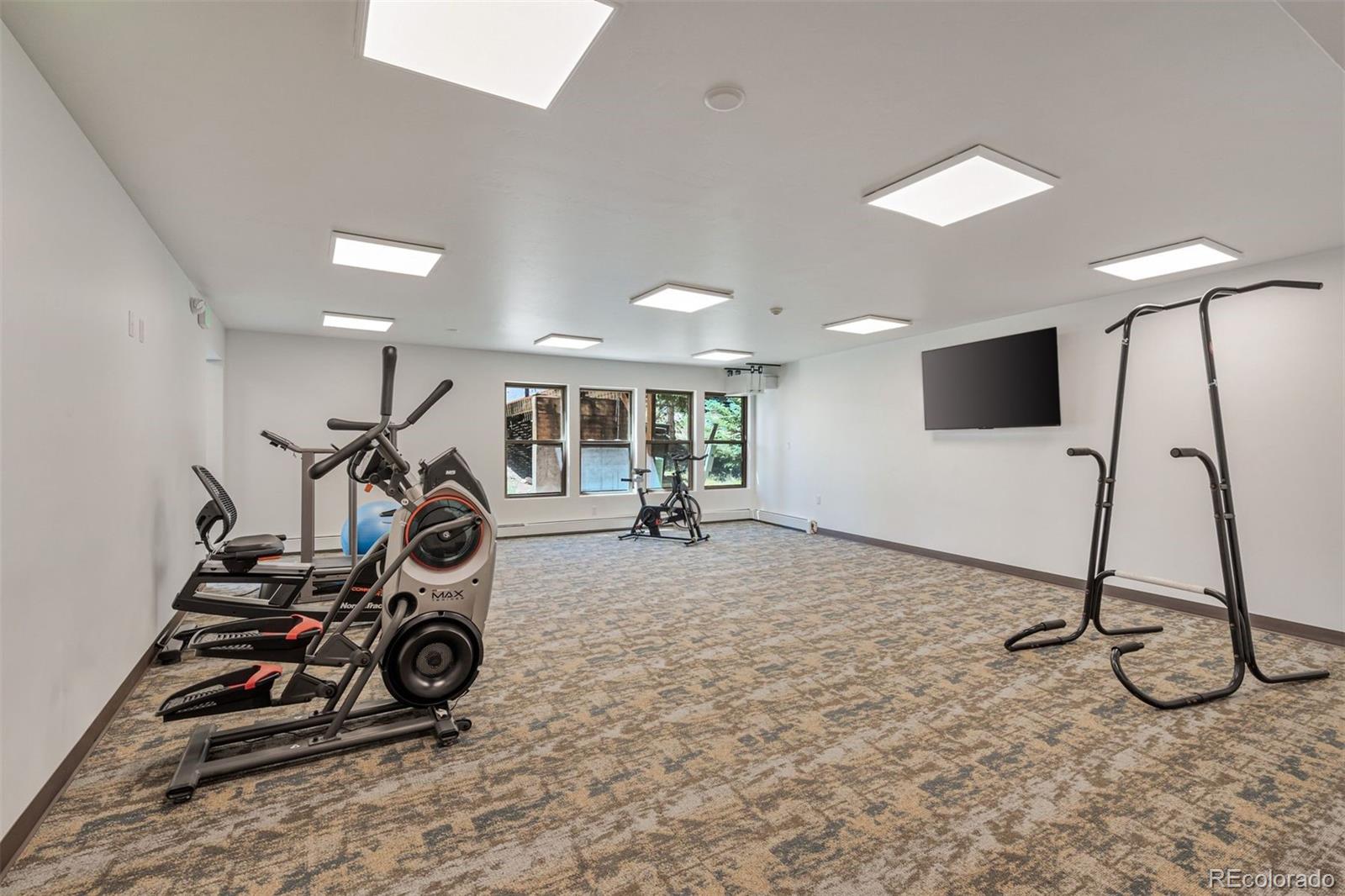 89310 Ryan Gulch Road, Unit 403 Silverthorne, CO 80498 - Photo 32 of 40 a view of a room with gym equipment