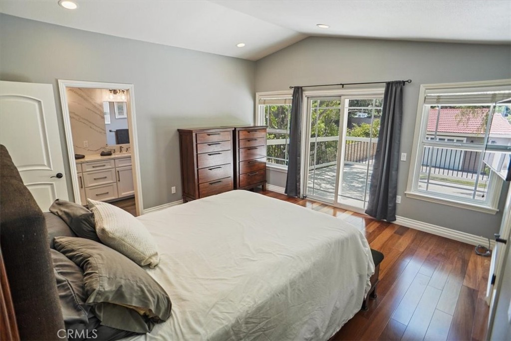 27763 Wakefield Road Castaic, CA 91384 - Photo 21 of 39 a bedroom with a large bed and wooden floor