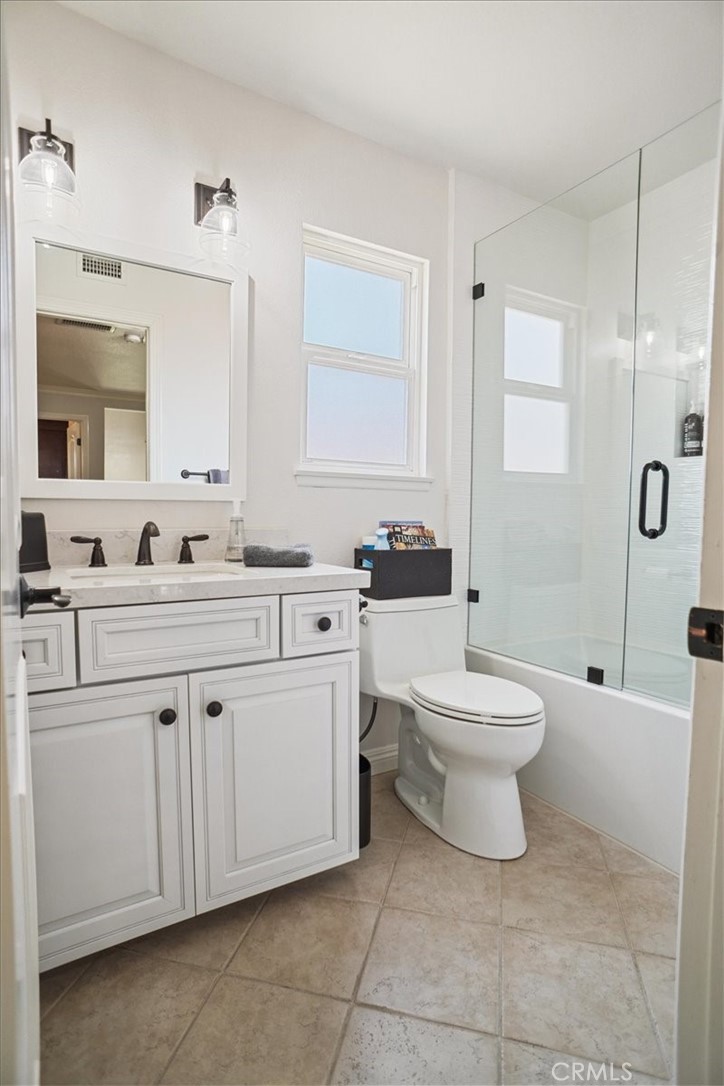 27763 Wakefield Road Castaic, CA 91384 - Photo 29 of 39 a bathroom with a toilet sink and mirror