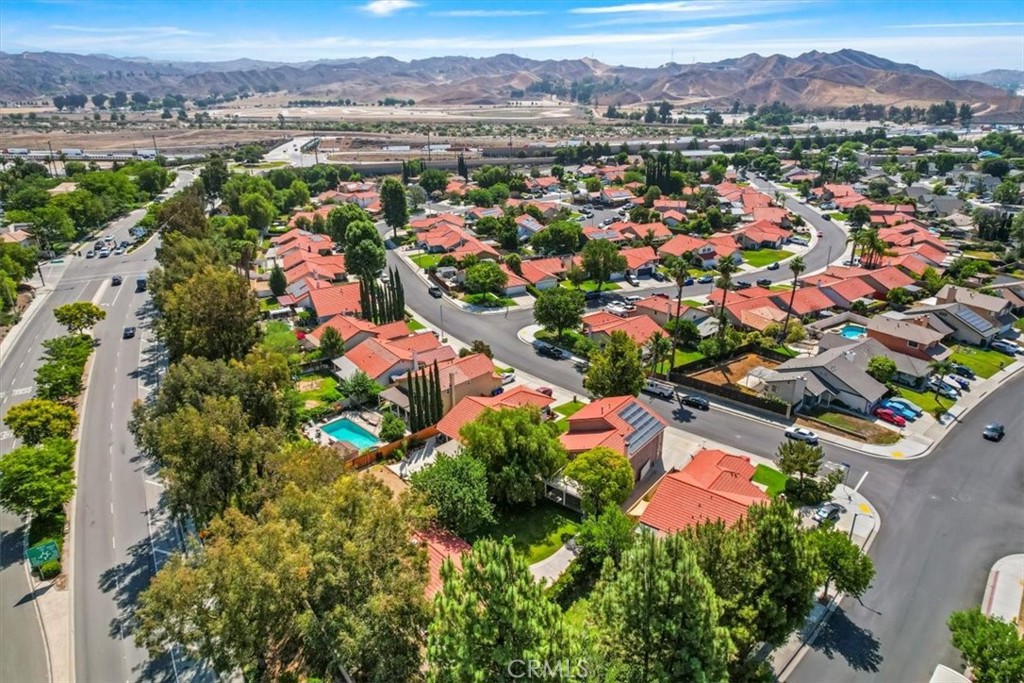 27763 Wakefield Road Castaic, CA 91384 - Photo 35 of 39 an aerial view of a city with lots of residential buildings and mountain view in back