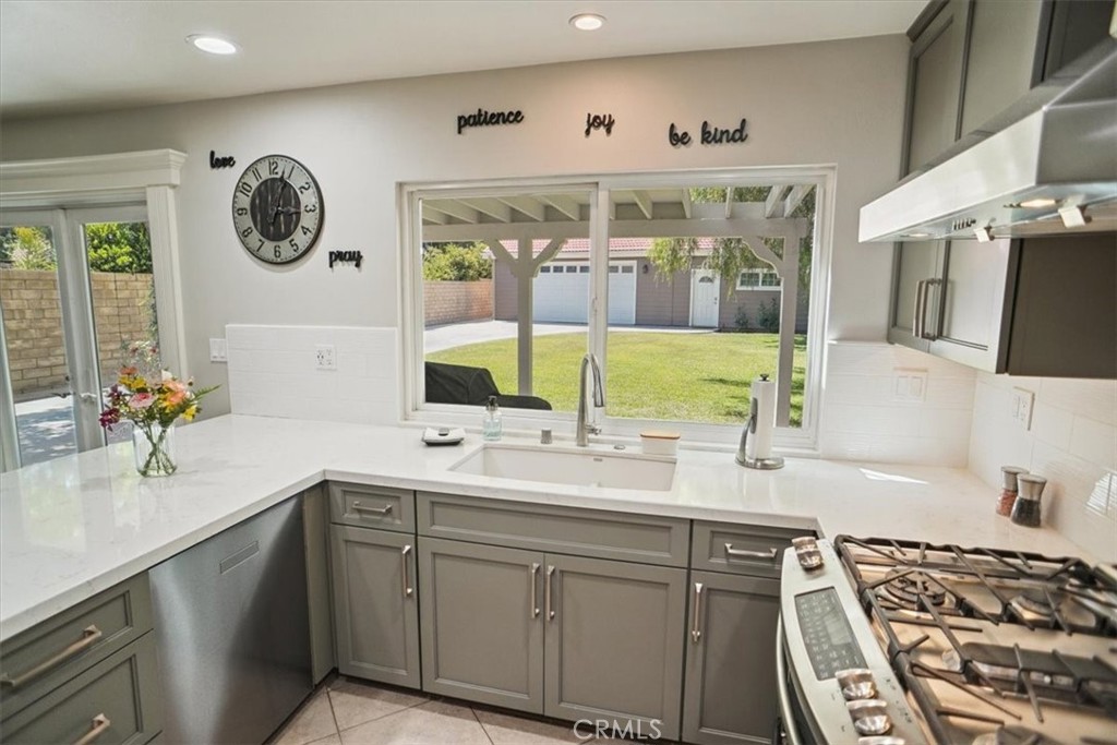 27763 Wakefield Road Castaic, CA 91384 - Photo 6 of 39 a bathroom with a granite countertop sink and a large mirror