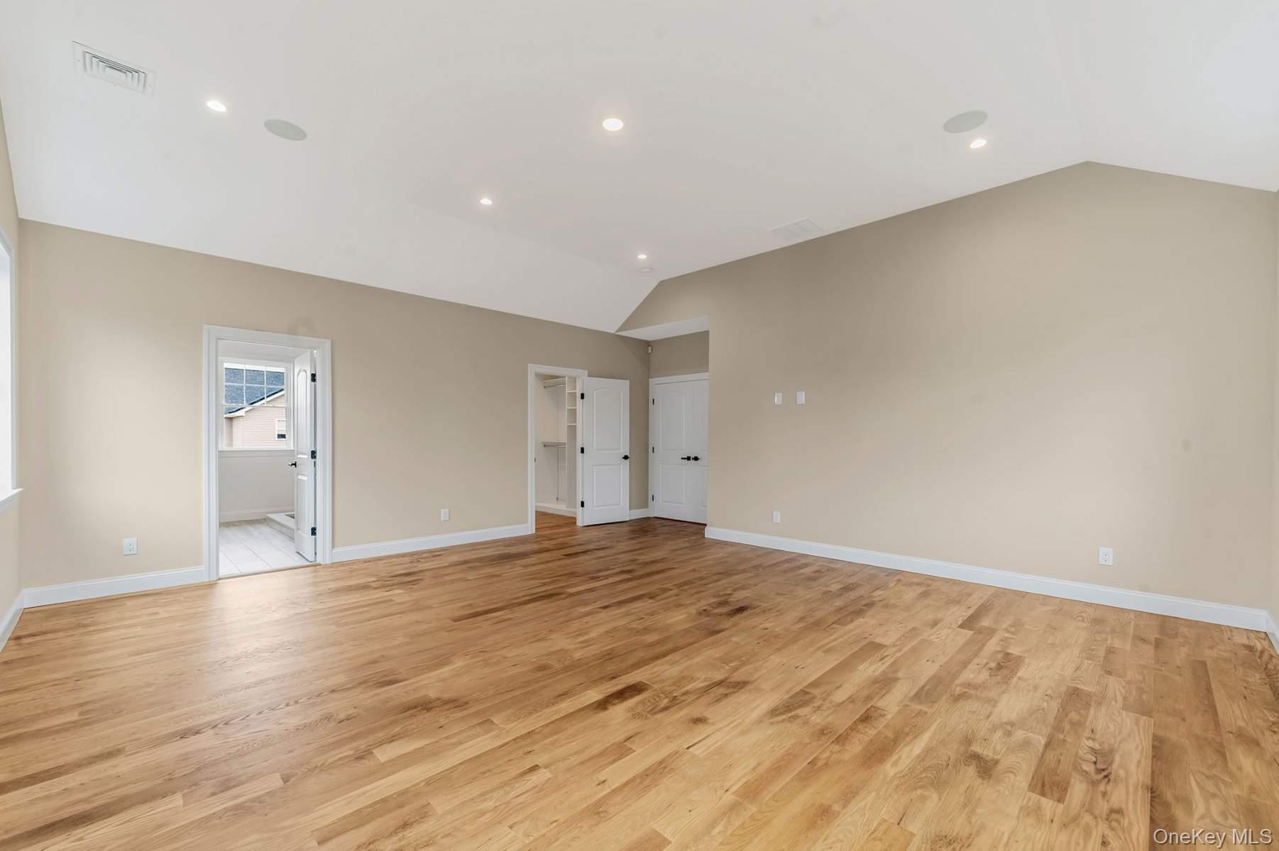 457 Pond Path East Setauket, NY 11733 - Photo 19 of 47 a view of empty room with wooden floor