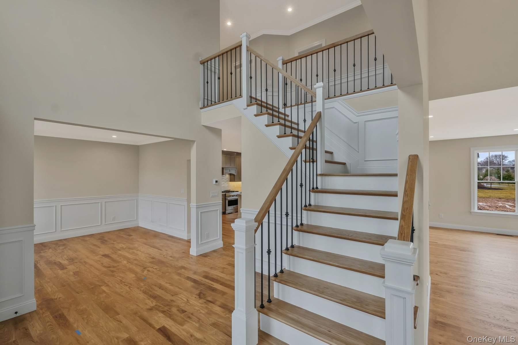 457 Pond Path East Setauket, NY 11733 - Photo 2 of 47 a view of entryway and hall with wooden floor