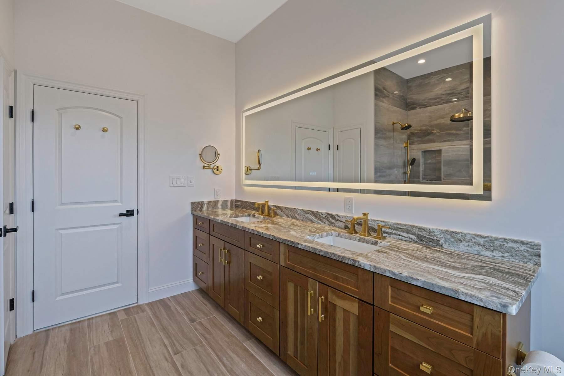 457 Pond Path East Setauket, NY 11733 - Photo 22 of 47 a bathroom with a granite countertop sink mirror and double
