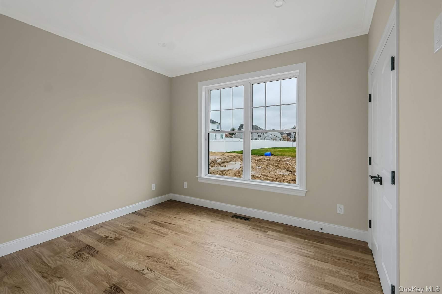 457 Pond Path East Setauket, NY 11733 - Photo 30 of 47 an empty room with window