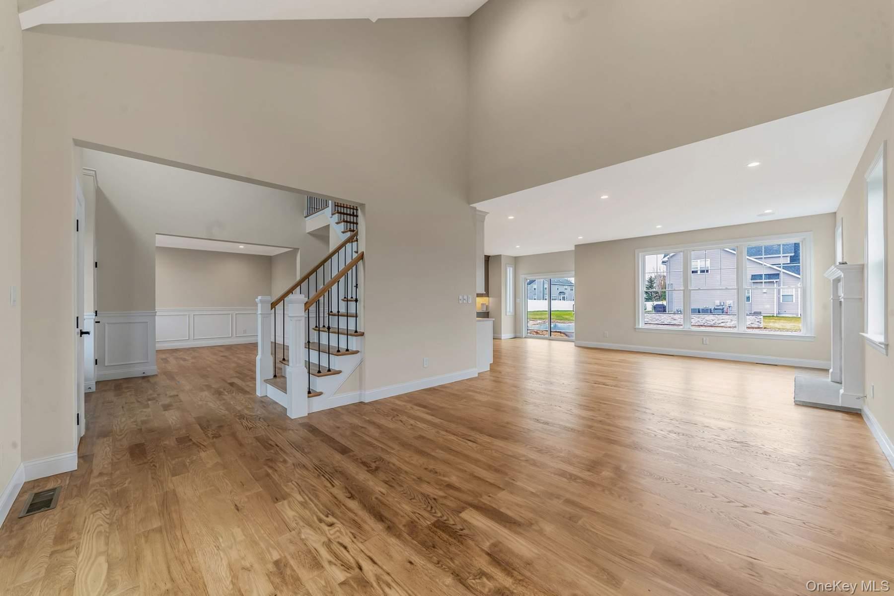 457 Pond Path East Setauket, NY 11733 - Photo 3 of 47 a view of a hallway with wooden floor