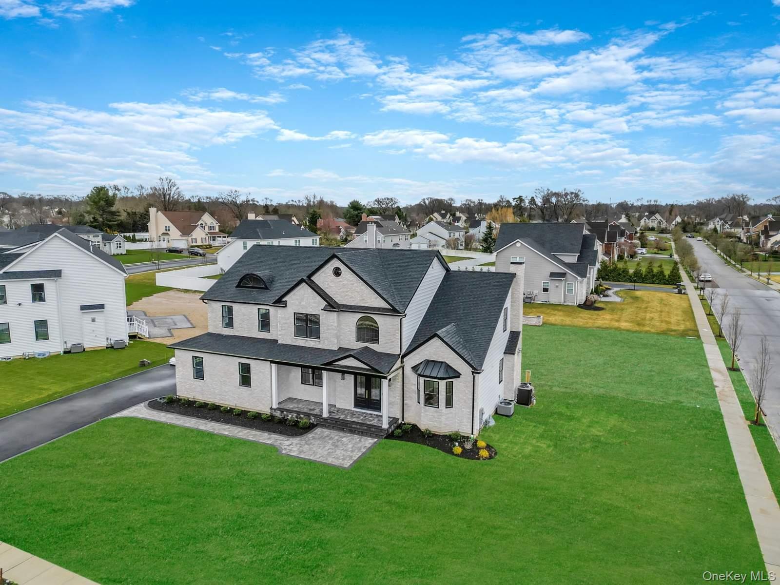 457 Pond Path East Setauket, NY 11733 - Photo 39 of 47 an aerial view of a house with a big yard