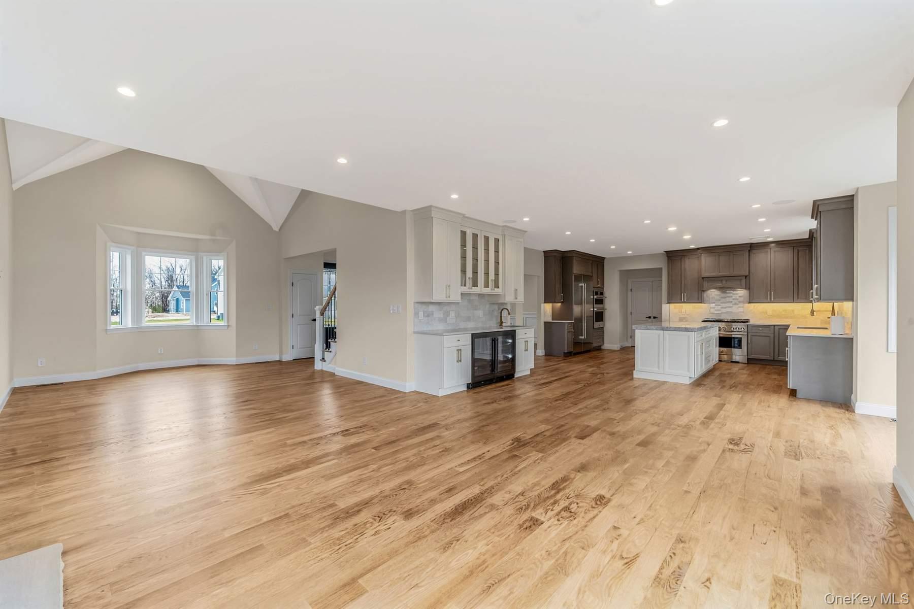 457 Pond Path East Setauket, NY 11733 - Photo 6 of 47 a view of kitchen with furniture and wooden floor