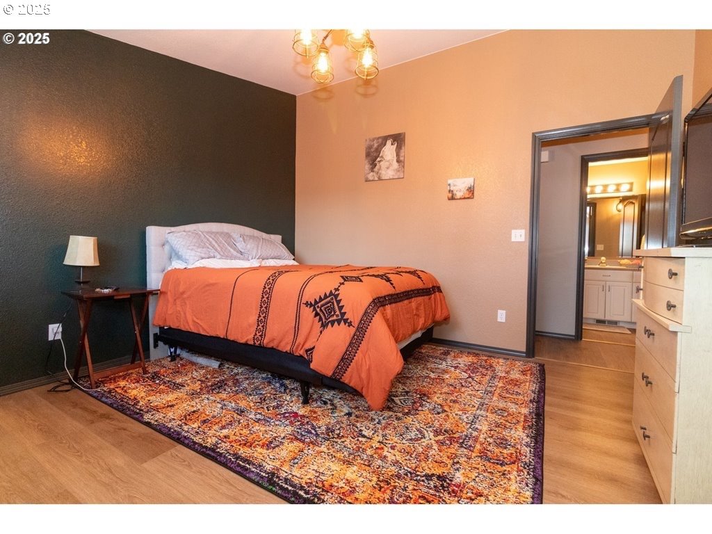 35 Wildwinds Street Florence, OR 97439 - Photo 14 of 32 a bedroom with a bed and a view of bathroom