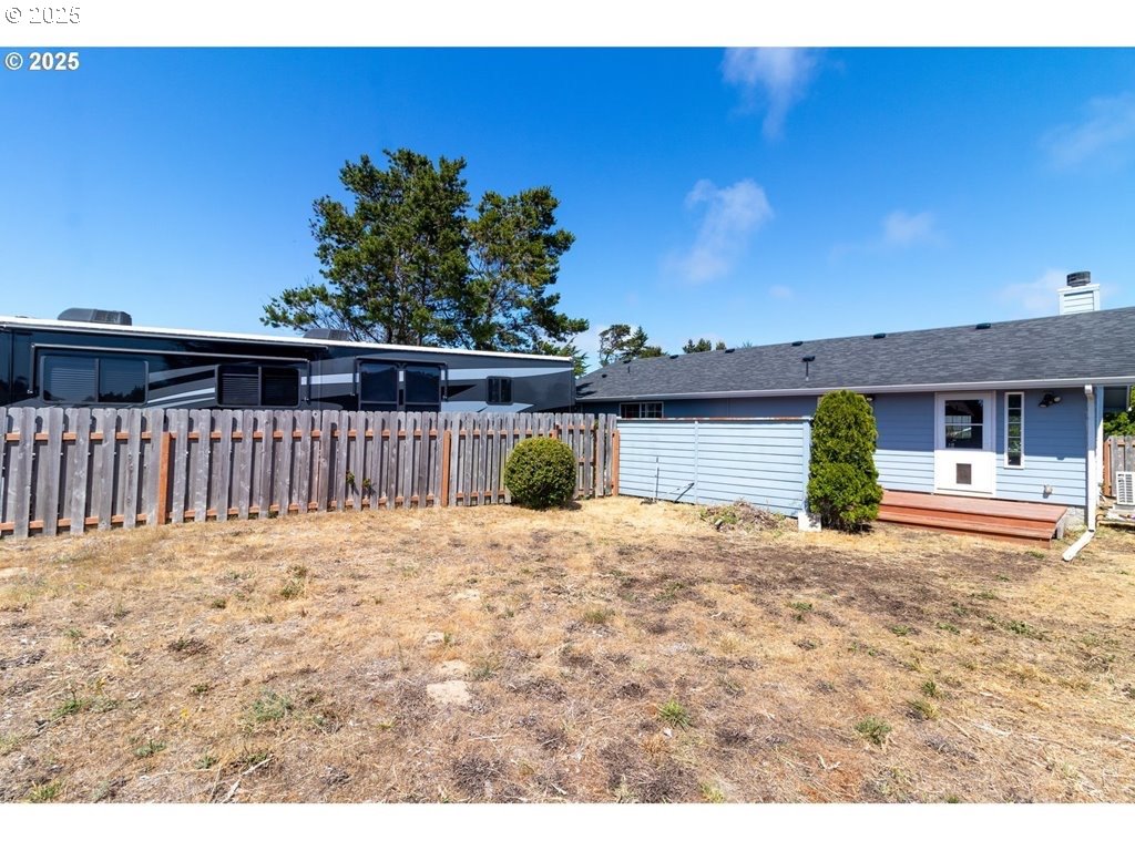 35 Wildwinds Street Florence, OR 97439 - Photo 21 of 32 a view of a house with backyard and sitting area