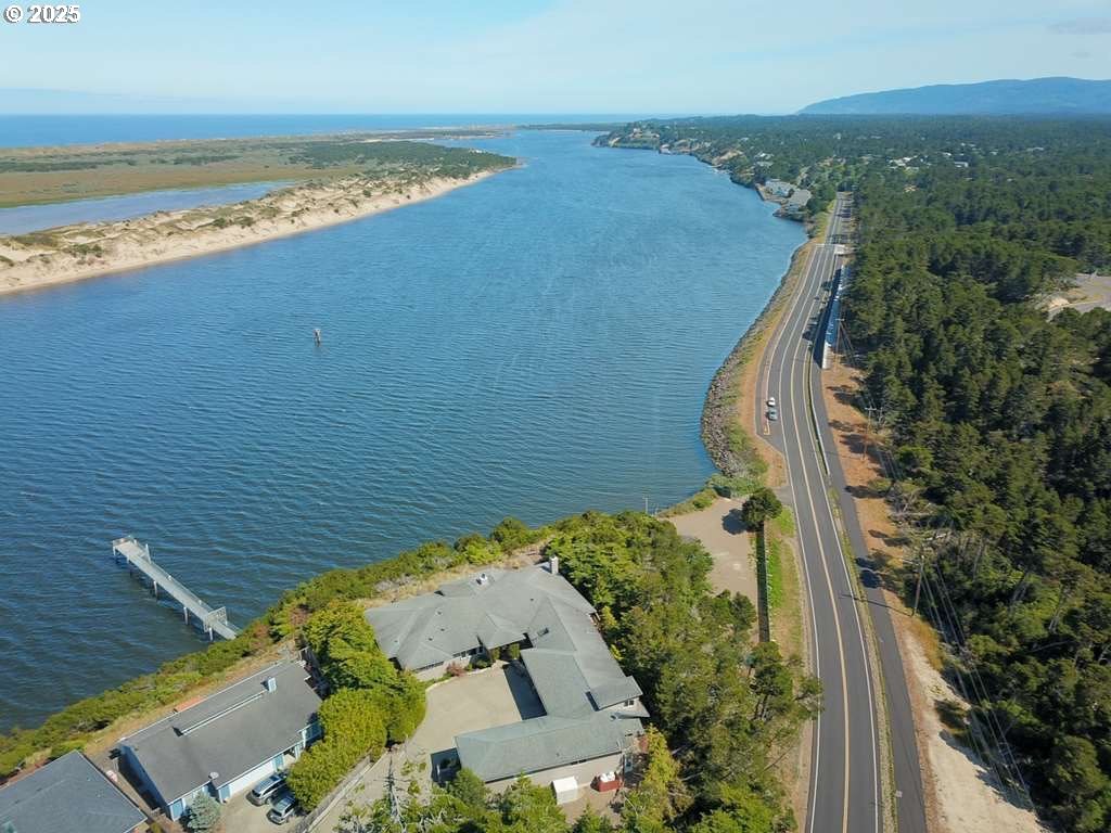 35 Wildwinds Street Florence, OR 97439 - Photo 27 of 32 an aerial view of a house with a yard and ocean view