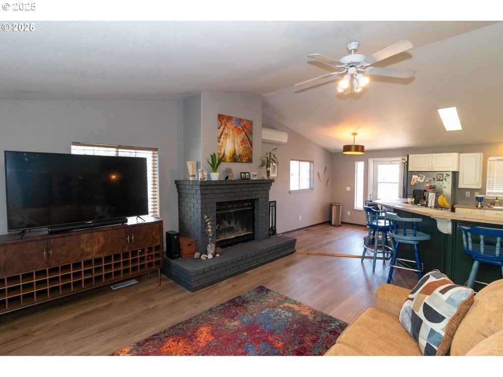 35 Wildwinds Street Florence, OR 97439 - Photo 6 of 32 a living room with furniture and a flat screen tv