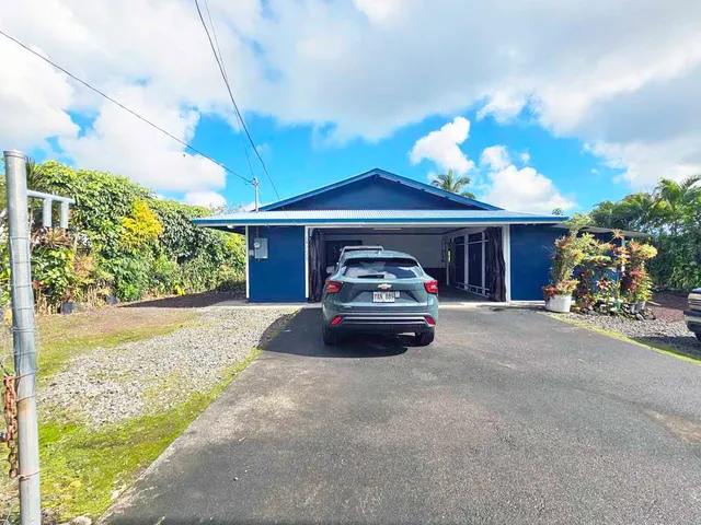 a view of a car parked in front of a house
